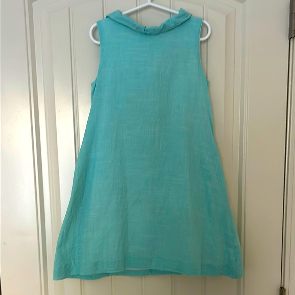 Kids Sleeveless Aqua Dress. The large bow detail on the back is just adorable.